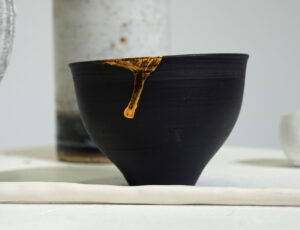 S14 Sarah Cooling 'Tea Bowl Moon Through Trees', Black Porcelain & Gold Lustre, £70