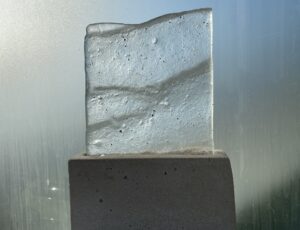 Dorrie King, ‘Records of a Tidal Observer’, Version 1,
Cast glass from pattern left by outgoing tide, cement plinth, 
31 x 21 x 6 cm