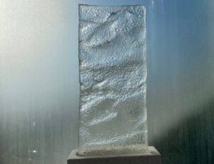 Dorrie King, ‘Records of a Tidal Observer’, Version 7,
Cast glass from pattern left by outgoing tide, cement plinth,
41 x 18 x 6 cm, £330