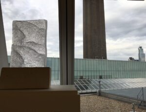 Dorrie King, ‘Blue Beach – Outgoing Tide’
Cast glass from pattern left by outgoing tide, cement plinth,
shown here in the Blavatnik Building,  Tate Modern,
42 x 29 x 8 cm, £1300