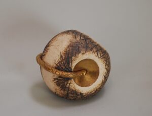 Valerie Kaufmann, 'Gold Bond' pod shaker. Stoneware ceramic with 24ct gold lustre, 10cm diam, £175