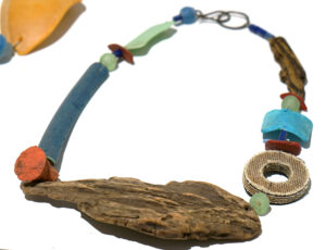Sarah Drew 'Wooden wave necklace: found plastic, recycled glass, rubber, driftwood', £175