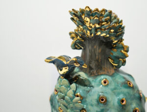 Katie Bunnell 'Tree Person with Bird Nest, 2023', ceramic sculpture: handbuilt terracotta, slip, gold lustre, 13 x 32 x 12cm, £350