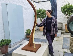 Julie Moselen installing her sculpture 'Woodland Sentinels', Corten Steel and 23.5ct Gold, 50 x 50 x 220cm, £6,500 Julie Moselen installing her sculpture 'Woodland Sentinels', Corten Steel and 23.5ct Gold, 50 x 50 x 220cm, £6,500