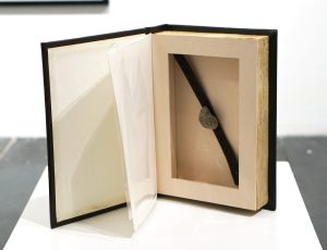 Andrew Lanyon ‘Hollow Book - Time (Continued)’, Wood, card, leather, watch strap and ammonite, 19 x 13.5 x 3.5cm, £2,000