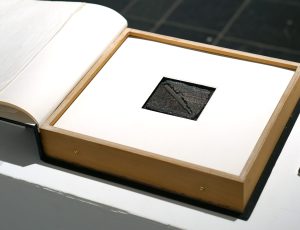 Andrew Lanyon Hollow Book - 'The Submariners of Sense' (2005), Lead type, toy lead submarine, card, wood and cloth 27.50 x 29.5cm, £5,000